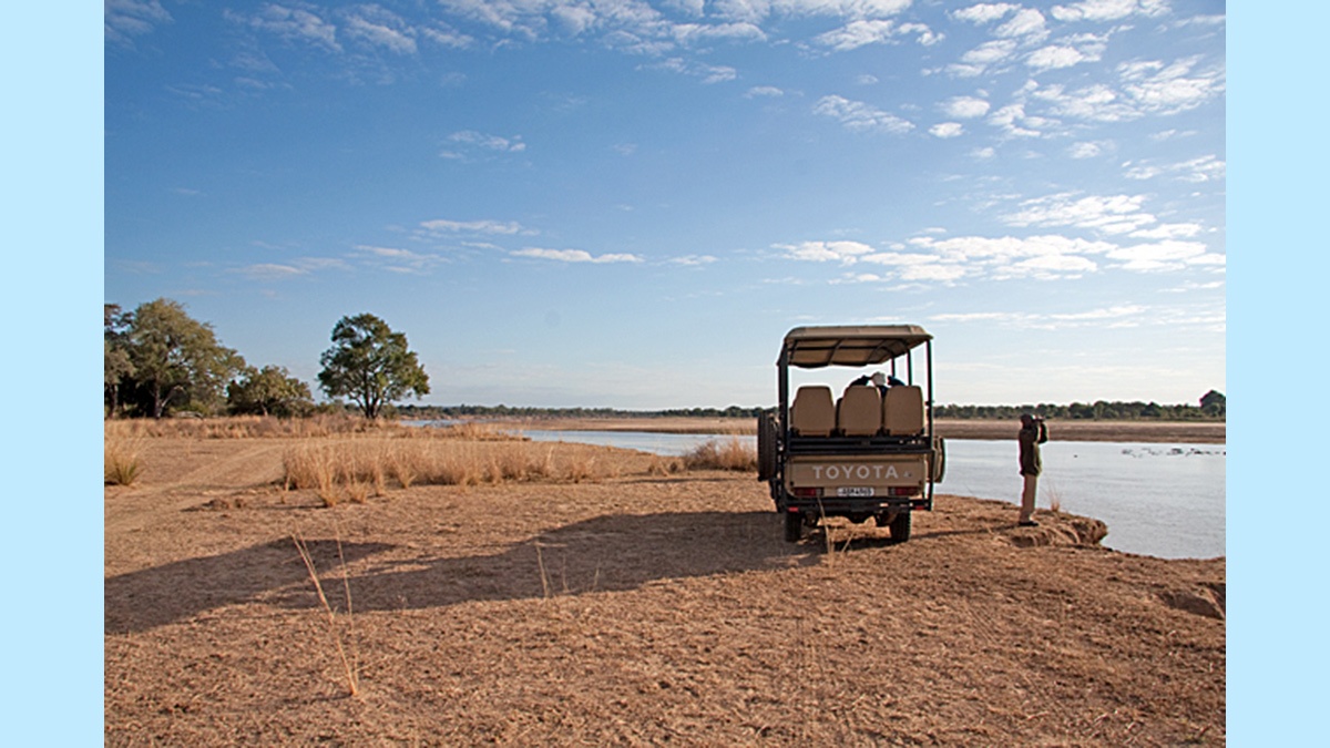 Game viewing vehicle on the banks of the Luangwa River